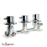 A high-resolution studio image of an Insignia 3-dial thermostatic shower mixer valve shown fully assembled in a horizontal layout against a clean white background. The valve features three polished chrome control dials mounted on circular backplates, connected by a solid metal manifold, as commonly fitted behind the control panel of an Insignia steam shower, shower cabin, or steam shower bath. This view shows how the valve appears once installed, helping homeowners identify a like-for-like replacement when an existing Insignia shower valve has failed or seized.